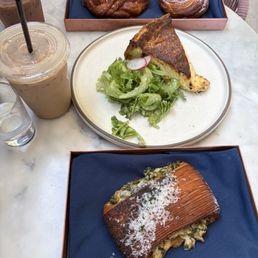 Quiche, spinach artichoke croissant, cardamom bun, and strawberry danish