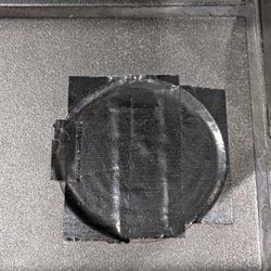 Lucky - Floor drain with duct tape over it. This does nothing to fix the problem, but tells us that they know about the problem.