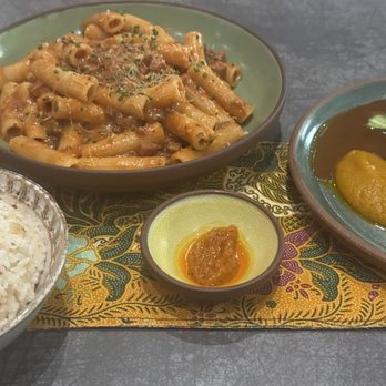 Kaya - left to right: garlic rice, Filipino bolognese, oxtail Kare Kare - Filipino Near Me - Orlando, Florida Kaya - left to right: garlic rice, Filipino bolognese, oxtail Kare Kare - Filipino Near Me - Orlando, Florida