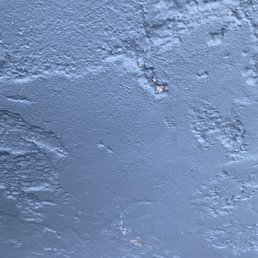 Efflorescence from moisture trapped under paint