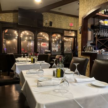 Olivio's Trattoria - a dining room with tables and chairs - Italian Near Me - Simi Valley, California Olivio's Trattoria - a dining room with tables and chairs - Italian Near Me - Simi Valley, California