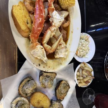 The Full Moon Oyster Bar - Charcoal Char-Grilled Oysters* 3 Lbs Snow Crab Legs & Ear of Steamed Corn - Bars Near Me - Asheboro, North Carolina