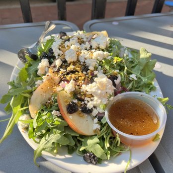Pies & Pints - The arugula goat cheese salad with a honey vinaigrette, apples, red onion, dried cherries and pistachios. - Pizza Near Me - Charleston, West Virginia