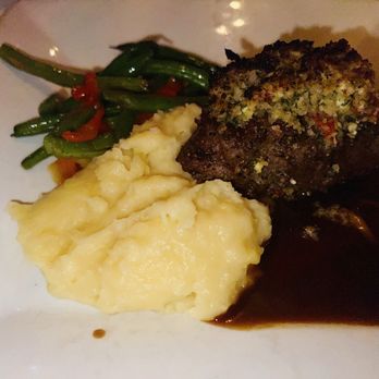 Russell's Steaks Chops & More - 6oz filet with goat cheese, demi glaze, mashed potatoes, and green beans with red peppers - Steakhouses Near Me - Williamsville, New York Russell's Steaks Chops & More - 6oz filet with goat cheese, demi glaze, mashed potatoes, and green beans with red peppers - Steakhouses Near Me - Williamsville, New York