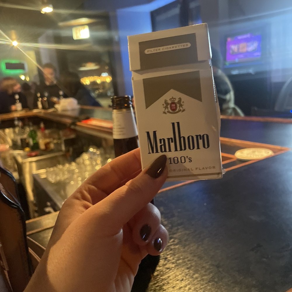 Lange's Lounge - a person holding a marlboro packet - Dive Bars Near Me - Chicago, Illinois Lange's Lounge - a person holding a marlboro packet - Dive Bars Near Me - Chicago, Illinois