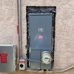 Custom Electric SD - 100A to 200A main electrical panel upgrade in Encinitas. Coordinated with SDG&E and the city. Stucco restoration completed afterward.