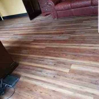 Flores Floors - a hardwood floor in a living room - Flooring Near Me Flores Floors - a hardwood floor in a living room - Flooring Near Me