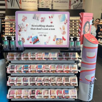 SEPHORA - Eye catching displays. - A Sephora display featuring various lipstick shades on shelves, with a digital screen advertising affordable shades, in a retail store setting. - Cosmetics & Beauty Supply Near Me - Pasadena, California