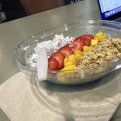 Full Well Cafe - Blue majik spirulina with ube drizzle, coconut, granola, strawberry and mango!