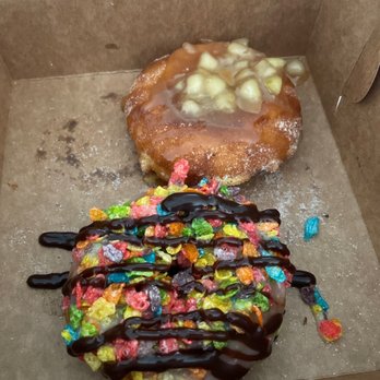 Nauti Donuts - "The Lifesaver" is the apple cinnamon donut with salty caramel drizzle. The closer one is a glazed donut, fruity pebbles, and hot fudge. - Donuts Near Me - Ocean City, New Jersey Nauti Donuts - "The Lifesaver" is the apple cinnamon donut with salty caramel drizzle. The closer one is a glazed donut, fruity pebbles, and hot fudge. - Donuts Near Me - Ocean City, New Jersey