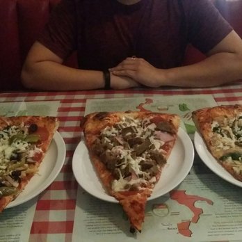 Pizza D'Oro - Giant slices...human placed in the background for scale - Pizza Near Me - Costa Mesa, California Pizza D'Oro - Giant slices...human placed in the background for scale - Pizza Near Me - Costa Mesa, California