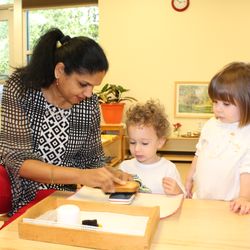 Arbor Montessori School - Toddler students receiving a lesson.