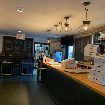 Dante's Pizza Company - pizzas stacked on a counter - Pizza Near Me - York, Maine