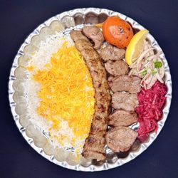Caspian Kababs - The Soltani Kebab combines a single skewer of Koobideh and a single skewer of Lamb kebabs , delivering tender, juicy kebabs with