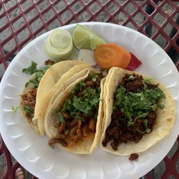 Al Pastor and Chorizo tacos without onion topping. Al Pastor and Chorizo tacos without onion topping.