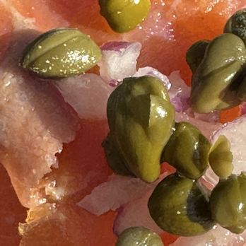 Soul Grind Coffee Roasters - Close-up of salmon, capers, and onion that was on top of the open faced toast - Coffee & Tea Near Me - Pacifica, California Soul Grind Coffee Roasters - Close-up of salmon, capers, and onion that was on top of the open faced toast - Coffee & Tea Near Me - Pacifica, California