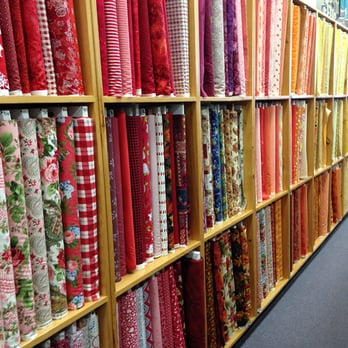 The Quilt Works - A really excellent selection of fabrics for quilting; this is one section that is organized by main fabric color. - Fabric Stores Near Me - Albuquerque, New Mexico