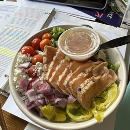 Greek salad with seared salmon .