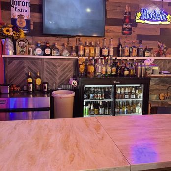 La Estancia - a bar with a television in the background - Mexican Near Me - Riverside, Illinois La Estancia - a bar with a television in the background - Mexican Near Me - Riverside, Illinois