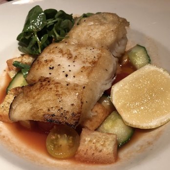 Beatrix - $27 halibut in a clear tomato broth bottom - New American Near Me - Chicago, Illinois