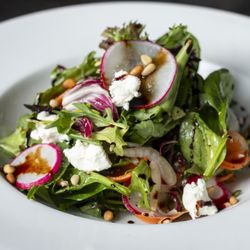 The Six Chow House - Our Organic Garden Salad, made fresh with Mixed Greens, Fennel, Radish, Basil, Carrots, Goat Cheese, Pine Nuts and Dijon Vinaigrette