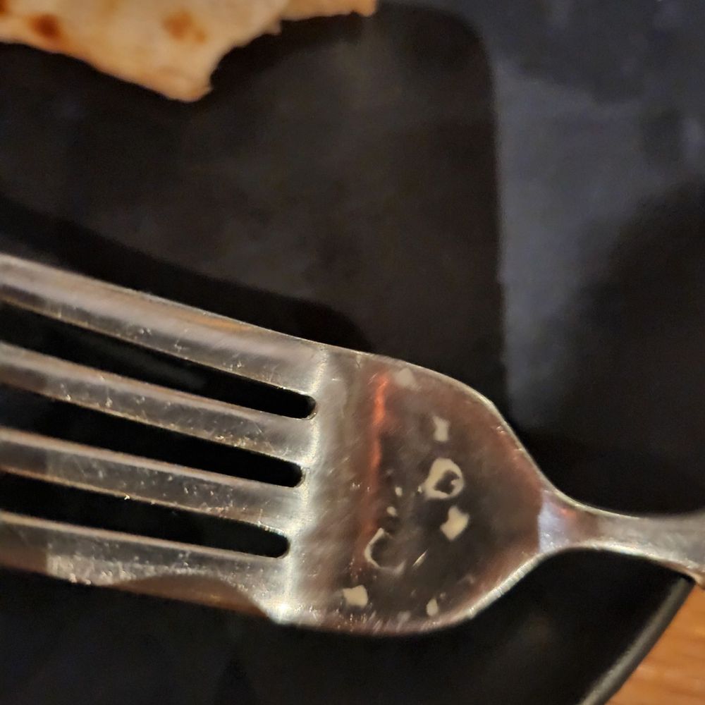Bigfire - Crusted food on fork - American Near Me - Orlando, Florida