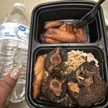 One Love Island Cuisine - This is the Oxtail Bowl with the baby finger dumpling. The small water bottle next to it so you can see the true size of this bowl. - Caribbean Near Me - Oceanside, California