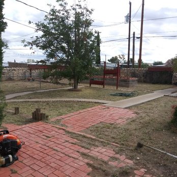 Guzman Lawn & Landscape - a view of a yard with a fire hydrant in the foreground - Lawn Services Near Me Guzman Lawn & Landscape - a view of a yard with a fire hydrant in the foreground - Lawn Services Near Me