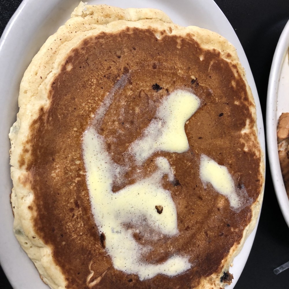 Tekonsha Cafe - a plate of pancakes with butter and nuts - Cafes Near Me - Tekonsha, Michigan