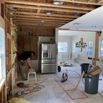 Hero Restoration - a man working in a home under construction - Damage Restoration Near Me Hero Restoration - a man working in a home under construction - Damage Restoration Near Me