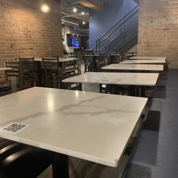 Pinched on the River - Some of the indoor seating, there is a bar and additional seating beyond the walls. - Mediterranean Near Me - Chicago, Illinois Pinched on the River - Some of the indoor seating, there is a bar and additional seating beyond the walls. - Mediterranean Near Me - Chicago, Illinois