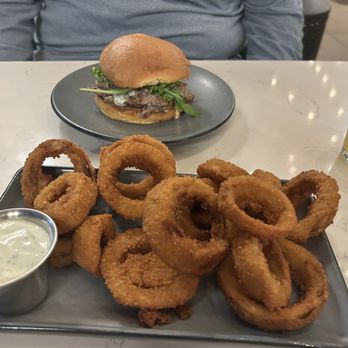 Hand Cut Chophouse - Steak sandwich (spicy) with a local IPA and delicious onions rings. - Burgers Near Me - Scottsdale, Arizona Hand Cut Chophouse - Steak sandwich (spicy) with a local IPA and delicious onions rings. - Burgers Near Me - Scottsdale, Arizona