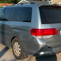 AM PM 24-7 Taxi Service - Light Blue Honda Odyssey rear picture.