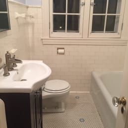 This was our small bathroom before - lacked storage, lacked proper lighting and dated subway tile (50 years dated)