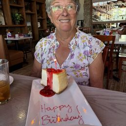 My Mom and her birthday cheesecake!