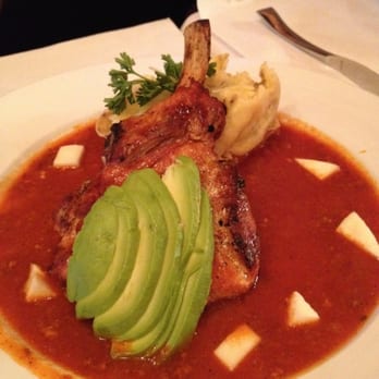 Sol de Mexico - Pork chop with red mole, avocado, and chorizo potatoes. - Mexican Near Me - Chicago, Illinois