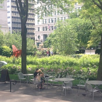 Piano Terra - a woman sitting at a table in a park - Street Vendors Near Me - Chicago, Illinois Piano Terra - a woman sitting at a table in a park - Street Vendors Near Me - Chicago, Illinois