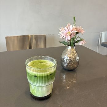 Manzil Cafe - Iced Black Sesame Vanilla Matcha in my to go cup - Cafes Near Me - South Brunswick Township, New Jersey