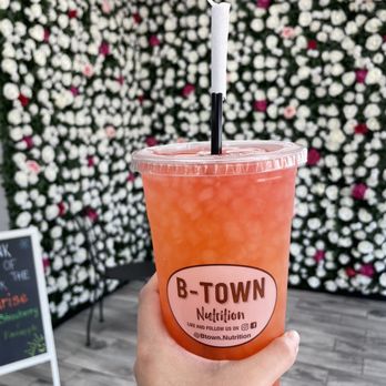 B-Town Nutrition - a hand holding a drink - Juice Bars & Smoothies Near Me - Bartlett, Tennessee