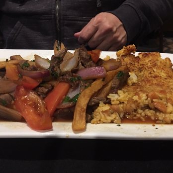 Machu Picchu - Tacu Tacu con Lomo Saltado. That fried bean thing is delicious! - Peruvian Near Me - Pineville, North Carolina