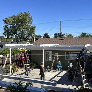 Patio Guy - Beams in place and first three rafters installed. - Patio Coverings Near Me