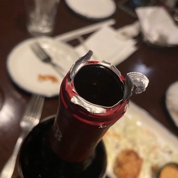 Red Lobster - a bottle of red wine and a plate of food - Seafood Near Me - Statesville, North Carolina