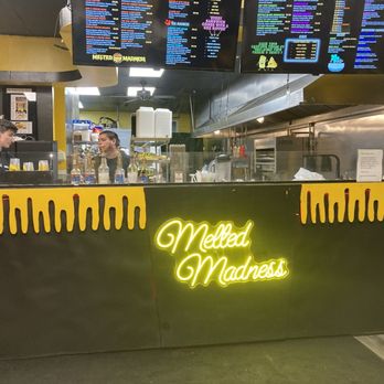 The Melted Madness - a neon sign in a restaurant - Sandwiches Near Me - Middletown, Connecticut