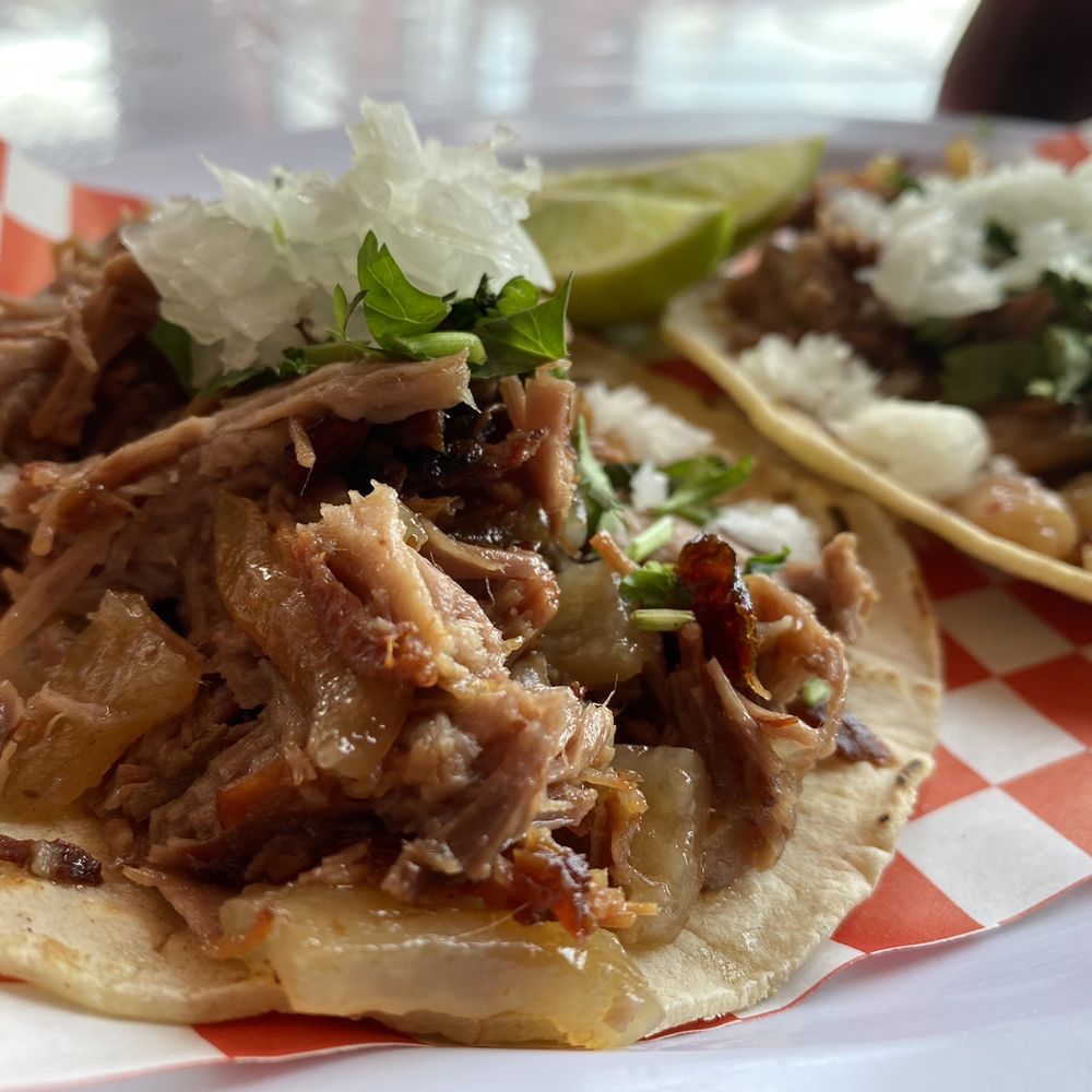 two tacos on a checkered plate two tacos on a checkered plate
