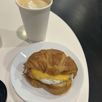 Paloma Coffee Co - Egg, cheddar, ham croissant and large latte - Bakeries Near Me - Windermere, Florida Paloma Coffee Co - Egg, cheddar, ham croissant and large latte - Bakeries Near Me - Windermere, Florida