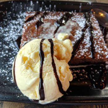 Kelseys Original Roadhouse - Chocolate berry cake with the vanilla ice cream sliding away - Comfort Food Near Me - Ottawa, Ontario