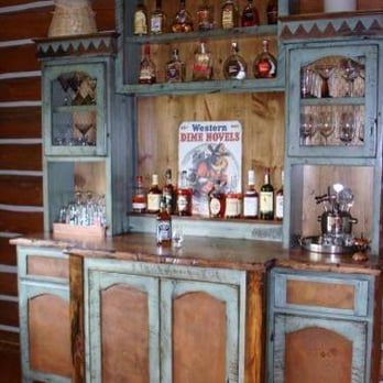 Affordable Solutions - a rustic bar in a log cabin - General Contractors Near Me