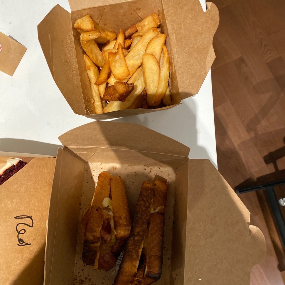 7 West Cafe - a box of french fries and a box of hotdogs - Italian Near Me - Toronto, Ontario