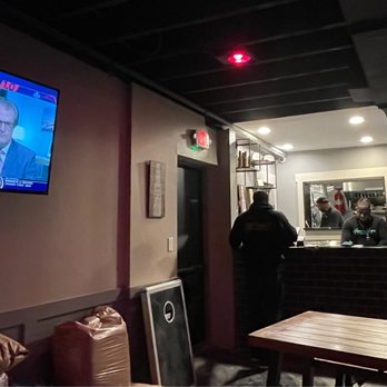 Hippin Hops Brewpub & Oyster Bar - TV & cornhole game near kitchen area. - Seafood Near Me - Atlanta, Georgia