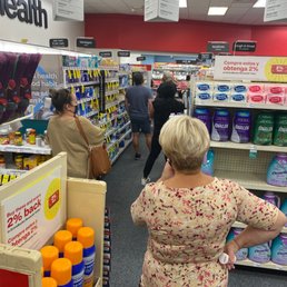 shoppers in a pharmacy store